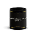 Black 11oz affirmation mug with gold text reading She Moves In Silence Arrives In Gold - Unbothered Co.