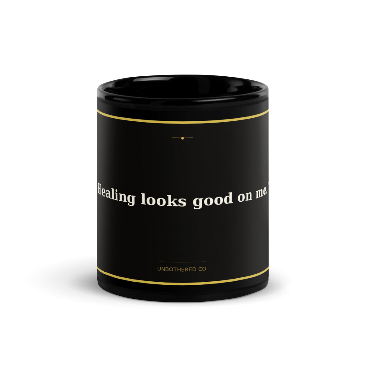 Black 11oz self-care affirmation mug with gold text reading Healing Looks Good On Me - Unbothered Co.